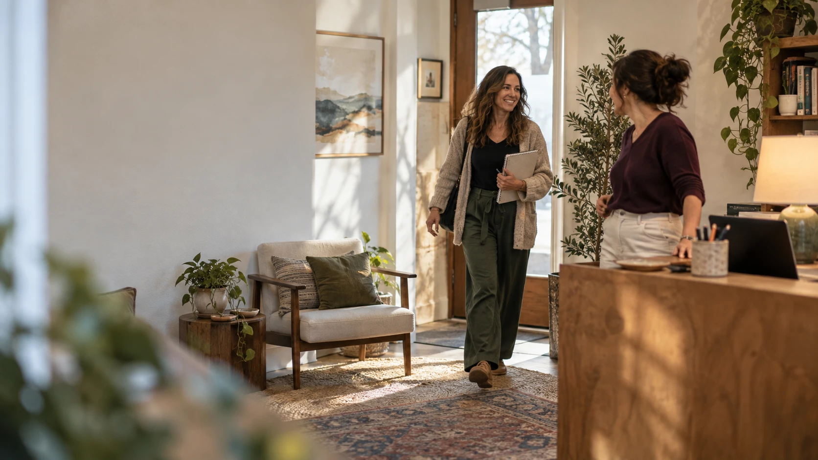 A therapist arriving at the front desk of a group practice